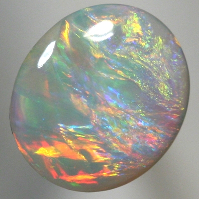 SOLID SEMI BLACK OPAL Pretty opal. Red and orange over green and purple. With VIDEO